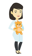 Image showing Pediatrician doctor holding teddy bear.