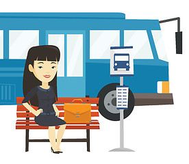 Image showing Business woman waiting at the bus stop.