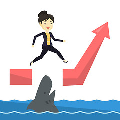 Image showing Business woman jumping over ocean with shark.