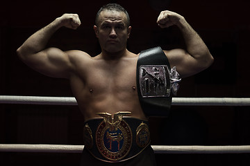 Image showing kick boxer with his championship belt