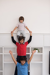 Image showing young boys posing line up piggyback