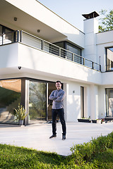 Image showing man in front of his luxury home villa