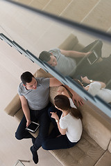 Image showing couple relaxing at  home with tablet computers