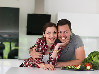 Image showing Young couple in the kitchen