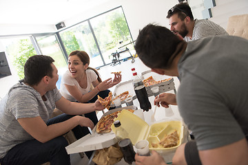 Image showing Pizza time a group of people