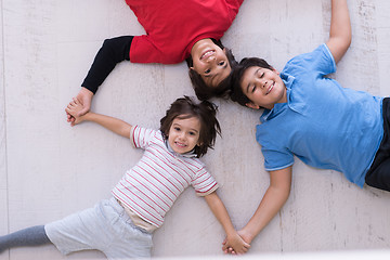 Image showing young boys having fun on the floor