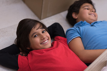 Image showing young boys having fun on the floor