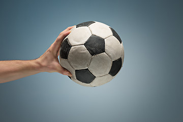 Image showing Hands holding soccer ball