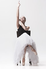 Image showing The teen ballerina in white pack sitting on chair