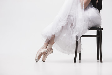 Image showing The teen ballerina in white pack sitting on chair