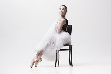 Image showing The teen ballerina in white pack sitting on chair