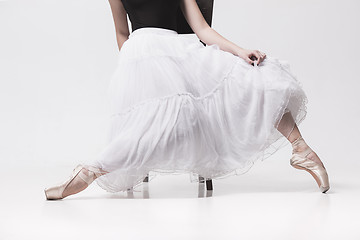 Image showing The teen ballerina in white pack sitting on chair