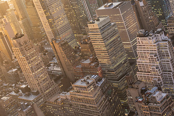 Image showing New York City skyline with urban skyscrapers at sunset, USA.