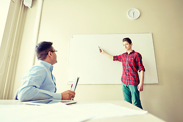 Image showing student boy at school white board and teacher