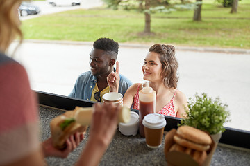 Image showing customers couple ordering hamburgers at food truck