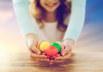 Image showing close up of girl and mother holding easter eggs
