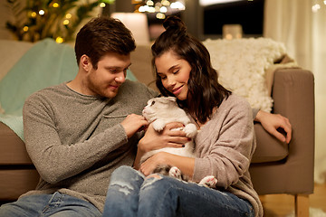 Image showing happy couple with cat at home