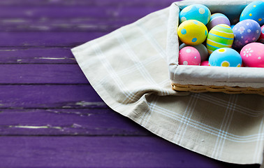 Image showing close up of colored easter eggs in basket