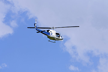 Image showing Blue helicopter flight in the sky