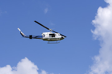 Image showing Blue helicopter flight in the sky