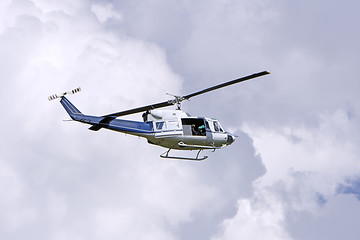 Image showing Blue helicopter flight in the sky