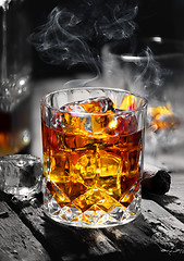 Image showing Whiskey on an old table