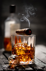 Image showing Cigar on a glass