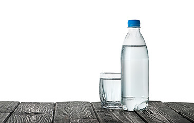 Image showing Plastic bottle and a glass with water