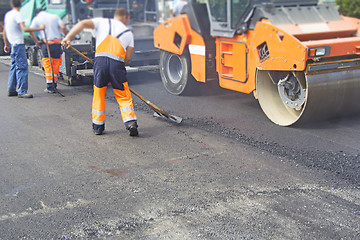 Image showing Construction workers on asphalting and road repair