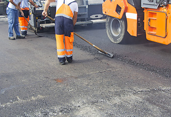 Image showing Construction workers on asphalting and road repair