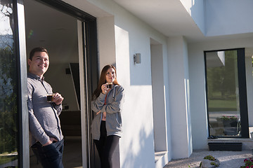 Image showing couple enjoying on the door of their luxury home villa