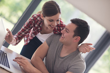 Image showing happy young couple buying online