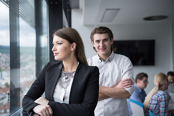 Image showing Elegant Woman Using Mobile Phone by window in office building