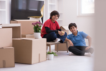 Image showing boys with cardboard boxes around them