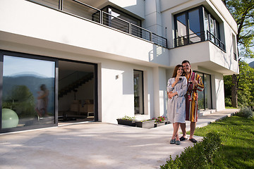 Image showing Young beautiful couple in bathrobes