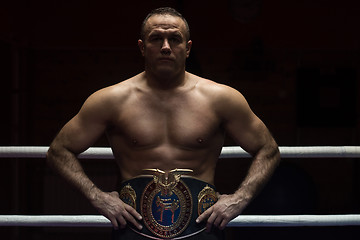 Image showing kick boxer with his championship belt