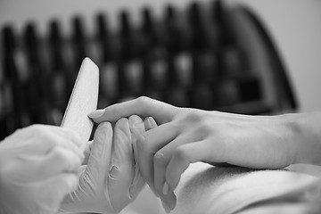 Image showing Woman hands receiving a manicure