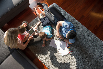 Image showing young couple spending time with kids top view