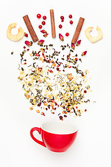 Image showing Beautiful and delicious dried tea leaves with herbs, flowers, berries, fruits, coconut slices, cocoa and coffee chips. Detailed studio shoot with selective focus and abstract blurred background