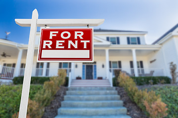 Image showing Right Facing For Rent Real Estate Sign In Front of House.