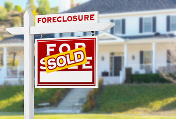 Image showing Right Facing Foreclosure Sold For Sale Real Estate Sign in Front