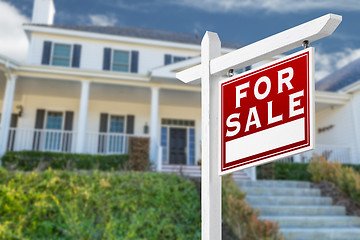 Image showing Right Facing For Sale Real Estate Sign In Front of House.