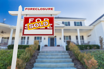 Image showing Right Facing Foreclosure Sold For Sale Real Estate Sign in Front