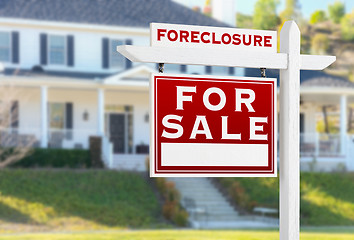 Image showing Left Facing Foreclosure For Sale Real Estate Sign in Front of Ho