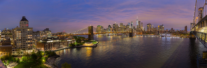 Image showing Brooklyn Bridge and Lower Manhattan skyline at night, New York city, USA.