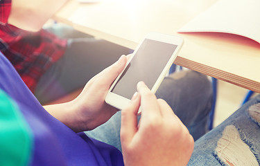 Image showing student girl with smartphone texting at school