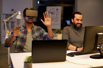 Image showing creative man in virtual reality headset at office