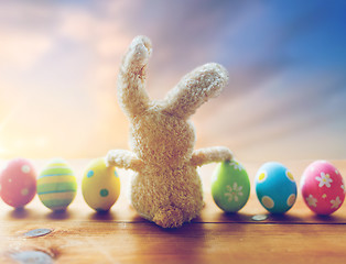 Image showing close up of colored easter eggs and toy bunny