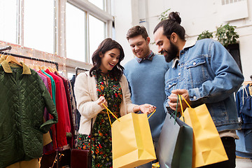 Image showing friends shopping bags at vintage clothing store