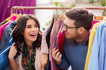 Image showing happy couple having fun at vintage clothing store
